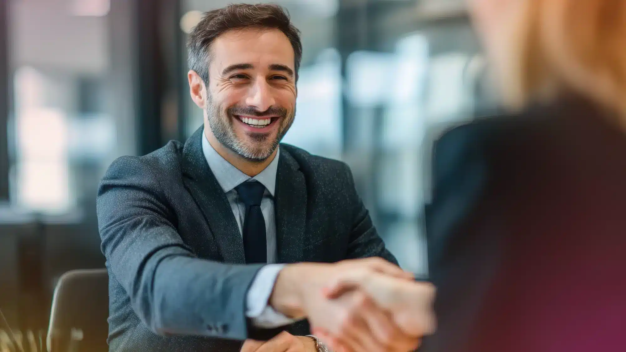 PCS Loan celebrating a successful business funding approval with a handshake in Florida.