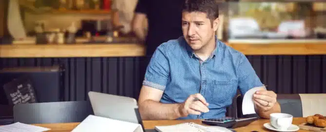 Entrepreneur in Georgia reviewing PCS Loan documents while preparing for a business funding application.