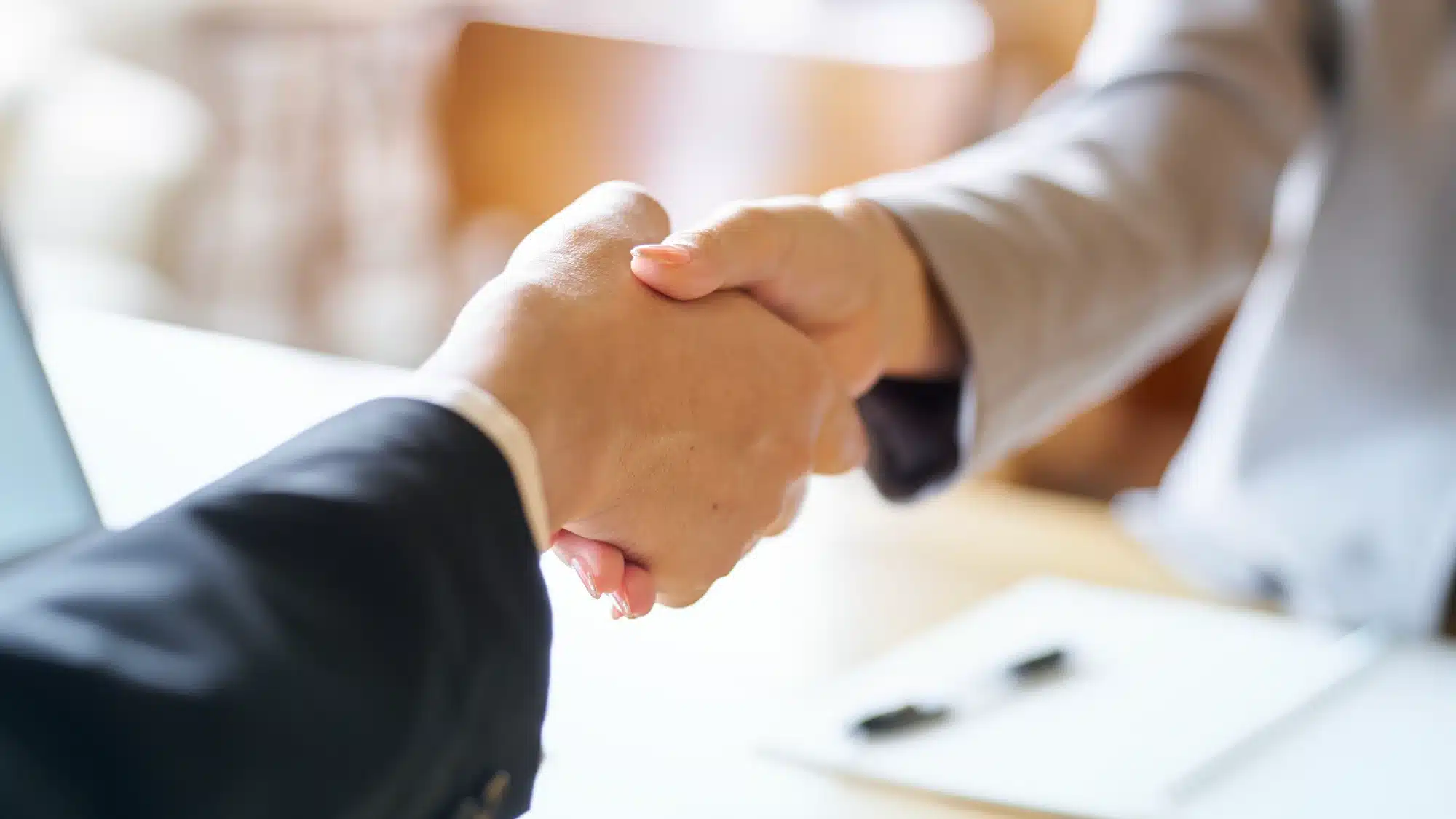 entrepreneur reviewing business acquisition loan documents and financial plans in burlingame california for small business financing options