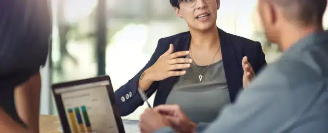 Entrepreneur reviewing documents and financial options for business acquisition financing including loans, investors, and funding structures