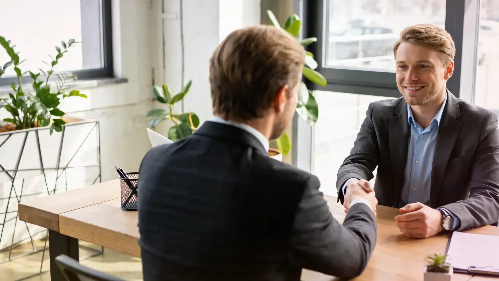 A professional calculating loan approval times for a small business in California.