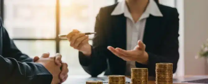 Business owner reviewing financial documents at desk