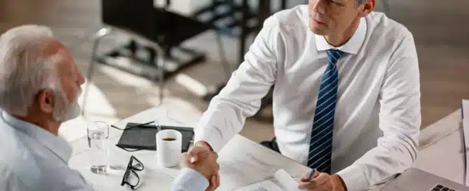 Business owner meeting with a lender to discuss business acquisition loans, financing requirements, loan benefits, and the application process.